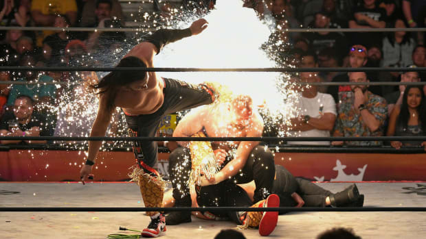 Matt Jackson delivers a superkick to Jon Moxley. His boot explodes in a shower of sparks.